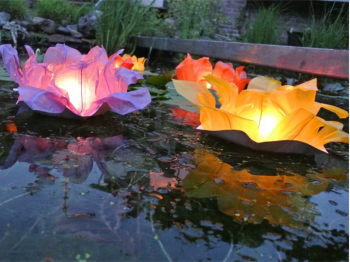 10 big floating paper water lanterns lotus flower shaped, mix of colors, candle included, easy to use, for pond or pool but also nice to put on the dining table o lawn, fold the flower, put the candle inside and let it float